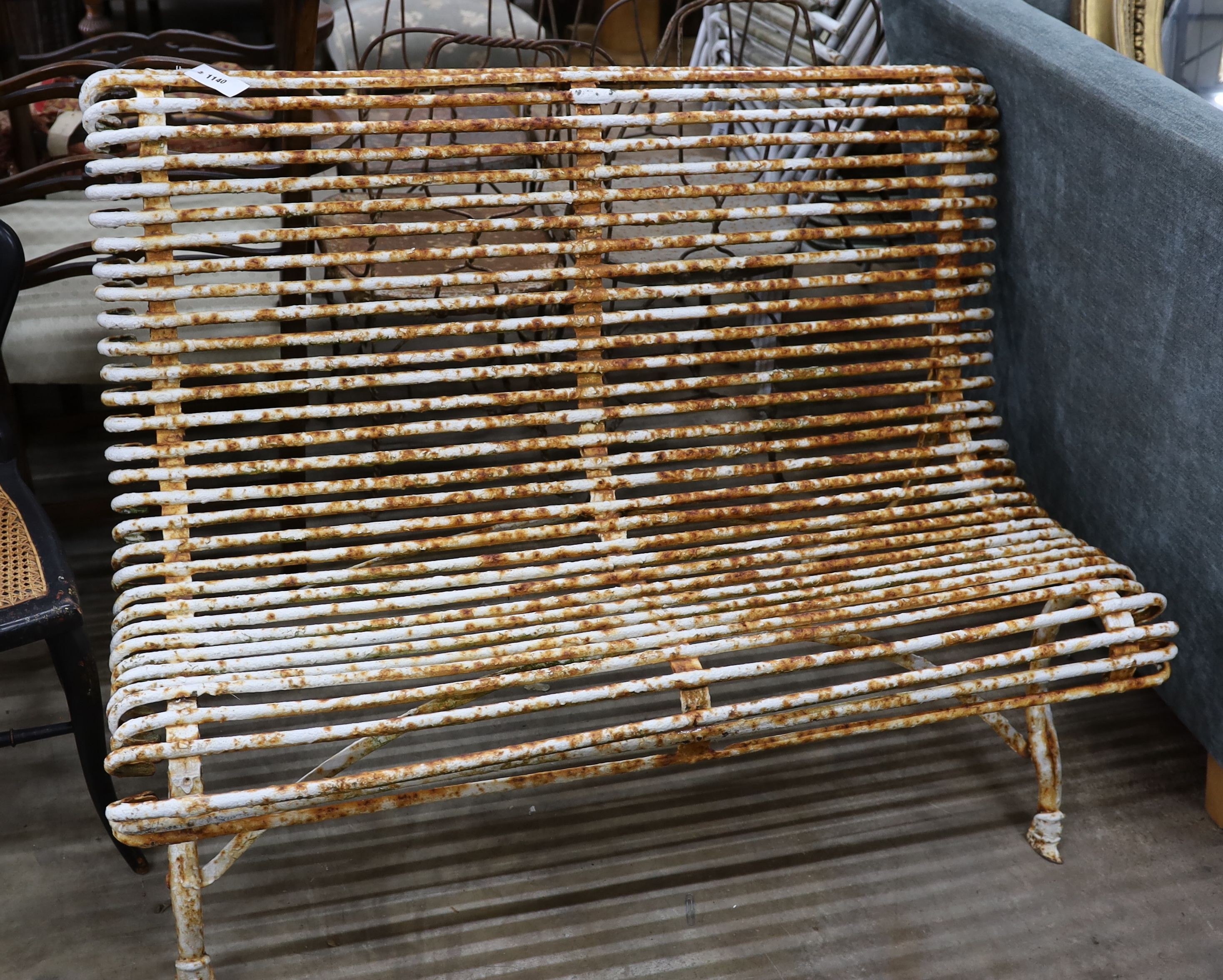 A painted wrought iron Aras bench, length 118cm, depth 66cm, height 83cm